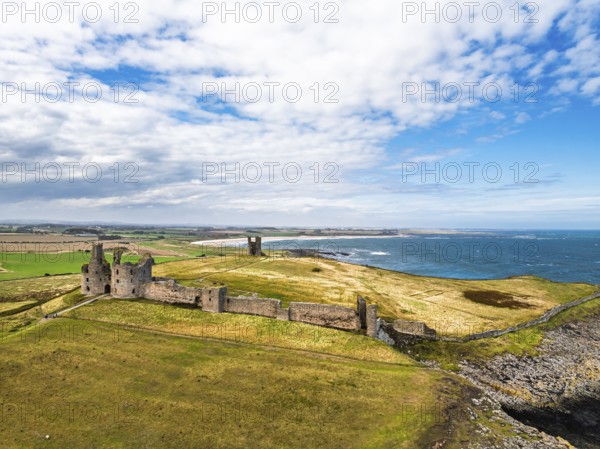 Dunstanburgh Castle from a drone, Northumberland Coast, England, United Kingdom