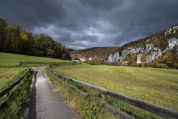 Käppeler estate with St. George's Basilica near Thiergarten in the upper Danube Valley, surrounded by autumn vegetation, Sigmaringen district, Baden-Württemberg, Germany