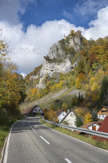 The L196 leads through the village of Hausen in the valley with the shovel and Hausen Castle, also known as the Hausen ruins, surrounded by autumn vegetation, Beuron, Sigmaringen district, Baden-Württemberg, Germany