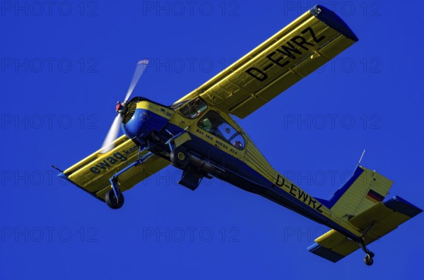 A PZL-104 Wilga-35A sport aircraft from Fliegerklub Kamenz with registration D-EWRZ during a flight demonstration as part of an air show on Rossfeld in Metzingen-Glems, Baden-Württemberg, Germany, for editorial use only