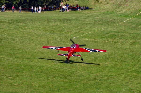 A Soviet Jakovlev Jak-55 sport aircraft with the registration LY-TOY during a flight demonstration as part of an air show on Rossfeld in Metzingen-Glems, Baden-Württemberg, Germany, for editorial use only