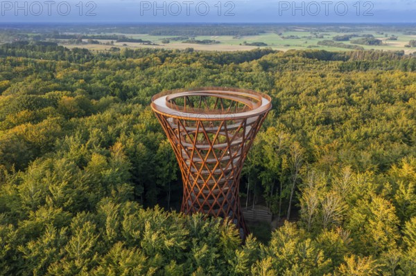 Aerial view over 45-meter-tall hyperboloid observation tower in forest near Gisselfeld monastery at Haslev on Zealand island in late summer, Denmark