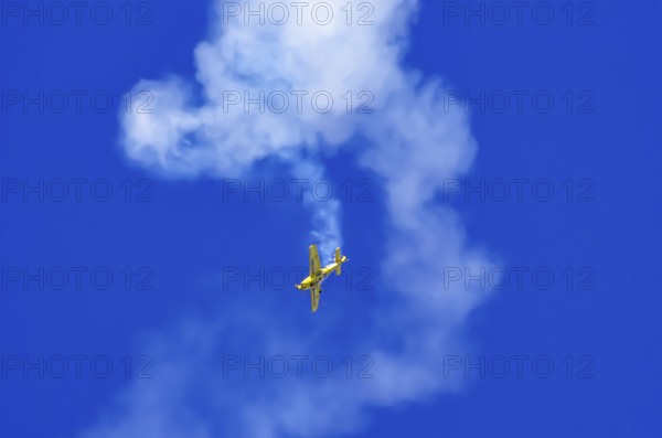 An Extra EA-300 from Extra Flugzeugproduktions- und Vertriebs GmbH with registration D-EXBH during a flight demonstration as part of an air show on Rossfeld in Metzingen-Glems, Baden-Württemberg, Germany, for editorial use only