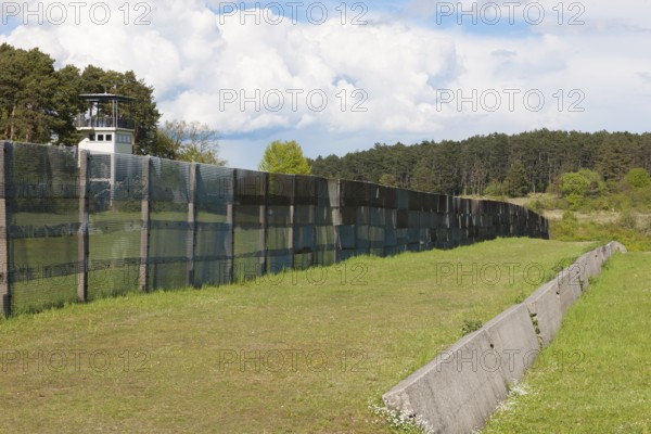 Original GDR border fence from 1970s with death strips on former zone border between West Germany and GDR East Germany, US watchtower on the left in the background, today open-air museum Memorial Museum Point Alpha, Rasdorf, Hesse, Geisa, Thuringia, Germany