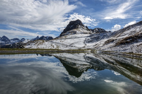 Kanzelwand is reflected in the reservoir, Kanzelwand snow-making pond, mountains of the Allgäu Alps behind, Vorarlberg, Austria