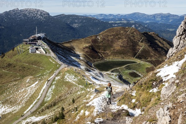 Female hiker on hiking trail below the Kanzelwand, back left Kanzelwandbahn mountain station, Kleinwalsertal, Vorarlberg, Allgäu Alps, Austria