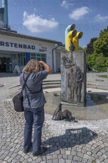 Photogrtaf photographs the Zanner fountain, created by artist Christa Bruder-Schön, erected in 2017 in front of Kurfürstenbad, Amberg, Upper Palatinate, Bavaria, Germany