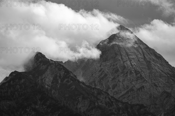 The cloudy summit of the Sonntaghorn, highest peak in the Chiemgau Alps, seen from Falkenstein near Inzell, Bavaria, Germany