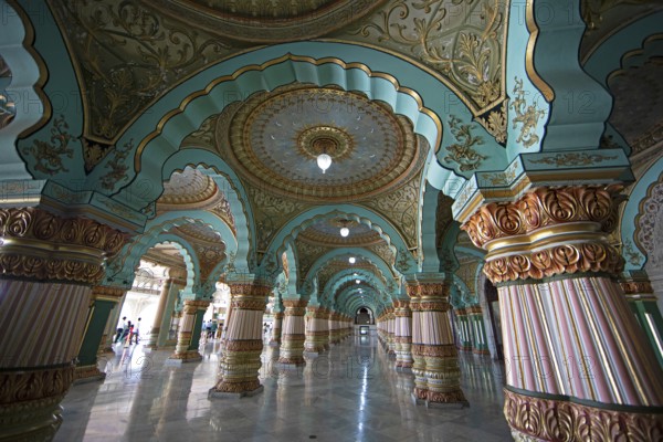 Granite columns with ornate arches and stucco ceilings, Durbar Hall in Mysuru Palace or Amba Vilas Palace, interior view, Mysore or Mysore, Karnataka, India