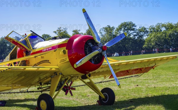 A PZL-106 AR Kruk agricultural aircraft with the registration D-FOAB and the original registration DDR-TAB as well as in the original colors of the company Agrarflug of Interflug as part of an air show on Rossfeld in Metzingen-Glems, Baden-Württemberg, Germany, for editorial use only