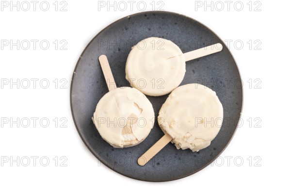 ?hocolate Ice cream in white glaze isolated on white background, top view, flat lay, close up, minimalism