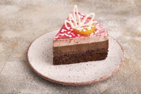 Chocolate cake on brown concrete background, side view, close up