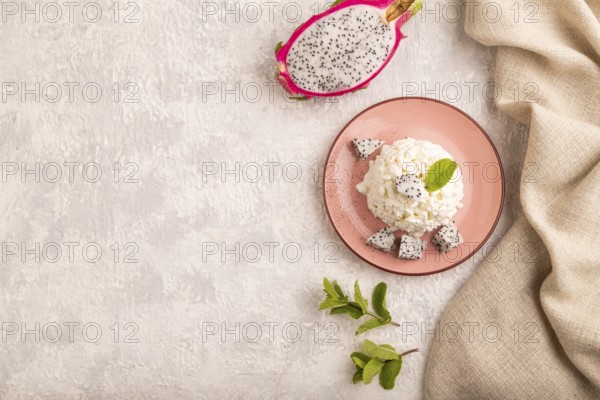 White ?ottage cheese, Curd, with Pithaya on gray concrete background and linen textile, top view, flat lay, copy space