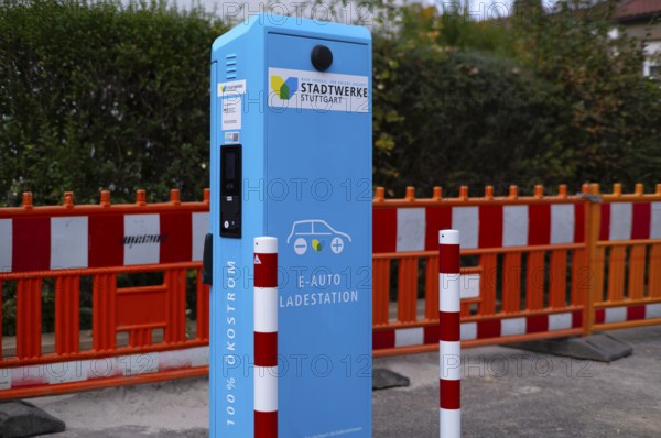 Parking lot with gas pump, EnBW charging station for electric cars, charging station, e-mobility, empty, free, unused, without e-car, pictogram, logo, construction site behind it, Stuttgart, Baden-Württemberg, Germany