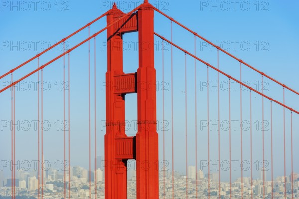 View of Golden Gate Bridge and financial district in the distance, San Francisco, California, USA