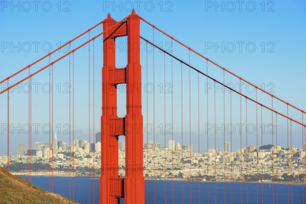View of Golden Gate Bridge and financial district in the distance, San Francisco, California, USA