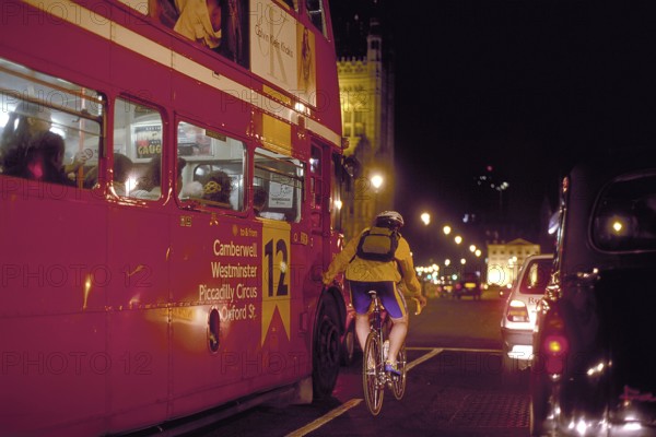 London at night, bus and cyclist on Westminster Bridge, London, England, Great Britain