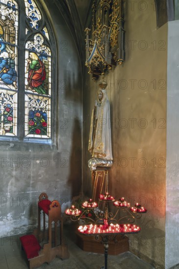Sacrificial candles with Saint Mary, St. Martin Church, Amberg, Upper Palatinate, Bavaria, Germany