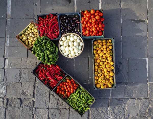 Traditional Mexican plaza with crates of peppers, onions, and tomatoes, economic prosperity in local trade, travel destination in America, AI generated
