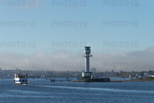 Green-white lighthouse Friedrichsort with city panorama of the state capital, Kiel Fjord, Kiel, haze bell, shipping, tower, architecture, landmark, orientation, navigation, shipping, blue sky, Schleswig-Holstein, Germany
