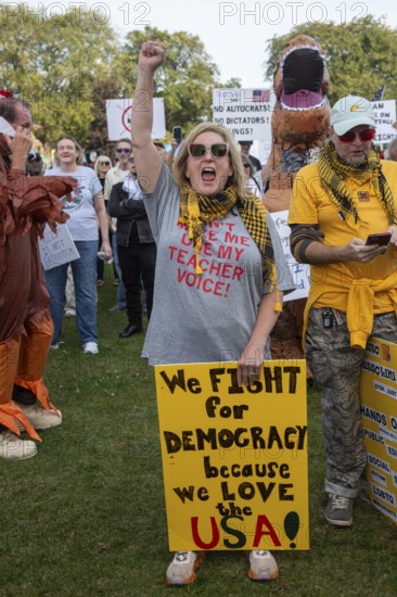 Detroit, Michigan USA - 18 October 2025 - A large crowd gathered for a 'No Kings' rally, protesting President Trump's actions against immigrants and against democratic institutions
