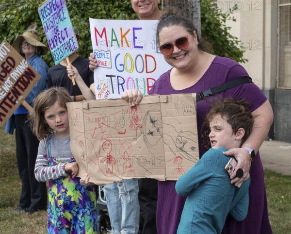 Detroit, Michigan USA - 18 October 2025 - Protesters from Detroit and Grosse Pointe gathered on the border between their cities for a 'No Kings' rally, protesting President Trump's actions against immigrants and against democratic institutions