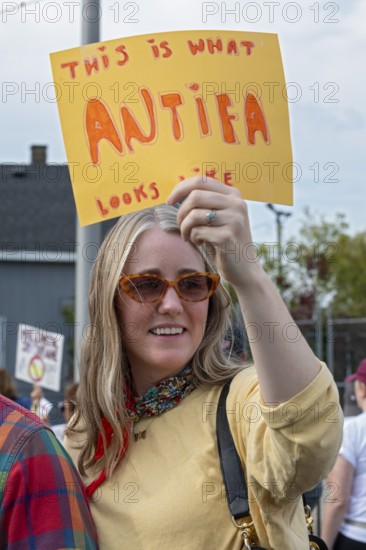 Detroit, Michigan USA - 18 October 2025 - Protesters from Detroit and Grosse Pointe gathered on the border between their cities for a 'No Kings' rally, protesting President Trump's actions against immigrants and against democratic institutions