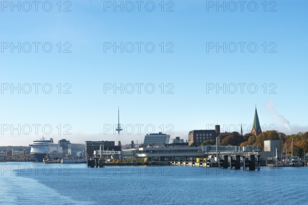 Kiel port, Kiel-Oslo ferry line, Color Line ferry and crusader, terminal at Sweden Quay, radio tower of St. Nikolai Church, Kiel Fjord, haze bell, blue sky, Baltic Sea, Schleswig-Holstein, Germany