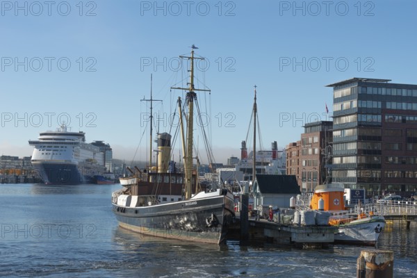 Kiel port, Seegarten museum bridge with historic tonneau buzzard from 1906 and sea rescue cruiser Hindenburg from 1944, chimney, crane, pier, Kiel-Oslo ferry on the east shore quay, ferry and crusader of the Color Line, maritime atmosphere, storage, architecture, radio tower, haze bell, blue sky, sunshine, Kiel Fjord, Baltic Sea, Schleswig-Holstein, Germany
