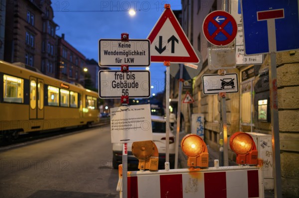 Sign forest, several traffic signs, construction site, stopping ban, dead end, oncoming traffic, subway, light rail, blue hour, dusk, Böblinger Straße, Stuttgart, Baden-Württemberg, Germany