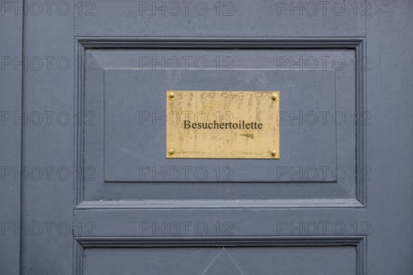 Visitor toilet sign on blue wooden door, Hesse, Germany