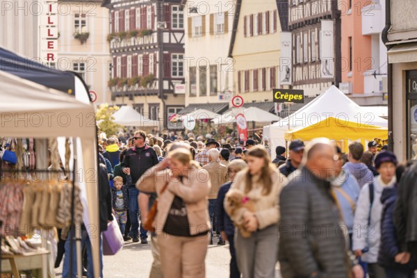 A bustling market with lots of visitors and stalls in an old town, Urschelherbst Street Festival, Nagold, Germany
