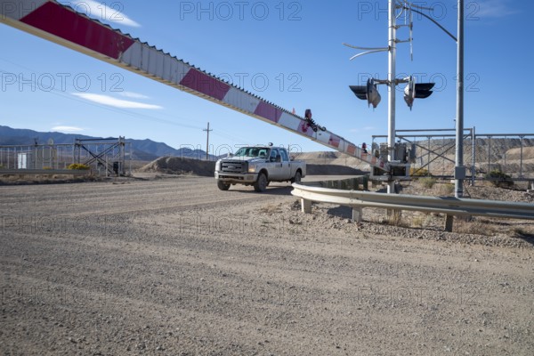 Round Mountain, Nevada - The Round Mountain Gold Mine, an open pit mine operated by Kinross Gold. The mine uses railroad-like crossing guards to block access at mine roads