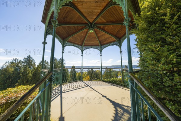 A pavilion overlooking a lake on a sunny day surrounded by trees, Überlingen, Lake Constance, Germany