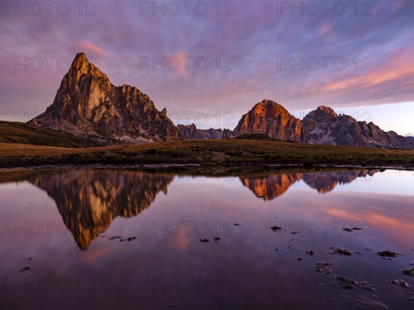 Alpine glow, reflection of the Ra Gusela and Tofane mountains at dawn, Passo di Giau, Giau Pass, Dolomites, Alps, Belluno province, Veneto region, Italy