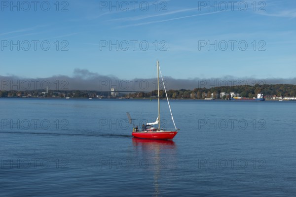 Kiel Fjord, Holtenau district, Kiel, Baltic Sea, high bridge over Kiel Canal, NOK, waterway, motoring sailor, SKN silo in the North Harbour, wooded slope, building, quiet sea, Schleswig-Holstein, Germany