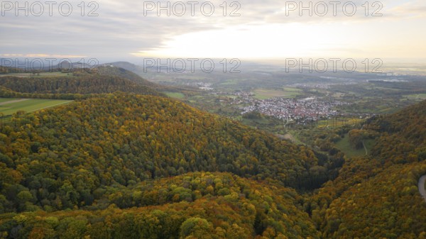 Indian summer at sunset on Albtrauf with a view of the Hohenneuffen castle ruins