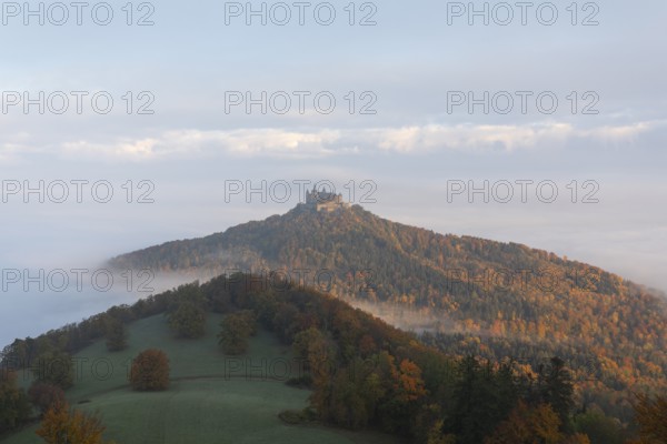 Hohenzollern Castle in a sea of fog at sunrise, autumn in the Swabian Jura