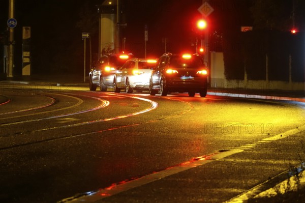 Road traffic at night and poor visibility in a city, autumn, Germany
