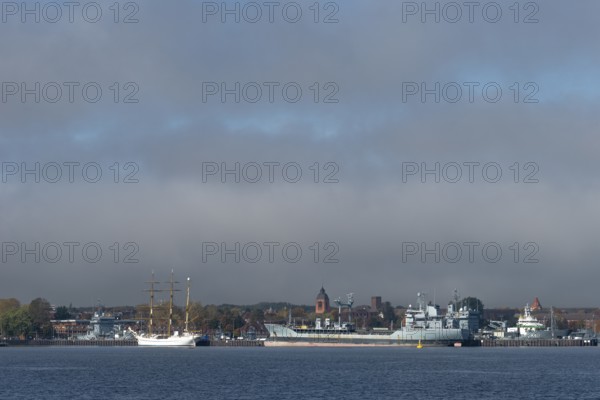 Kiel naval port, district of Wik, sailing school ship Gorch Fock in their home port, fuel transporter A1442 Spessart of the German Navy, supply ship A512, tower of the Garrison Church of St. Peter's Church, Schleswig-Holstein, Germany