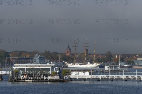 Kiel naval port, district of Wik, sailing school ship Gorch Fock in their home port, tower of the garrison church Petrus-Kirche, Seebar Düsternbrook, Schleswig-Holstein, Germany