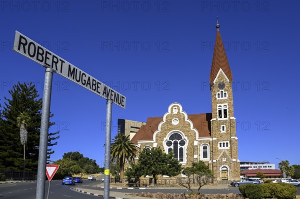 Robert Mugabe Avenue sign in front of the 1910 Evangelical Lutheran Christ Church, Windhoek, Khomas region, Namibia