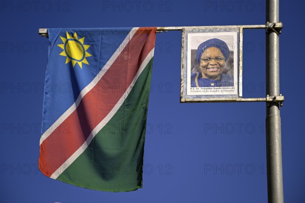 Namibian flag and image of President Dr. Netumbo Nandi-Ndaitwah, Windhoek, Khomas region, Namibia