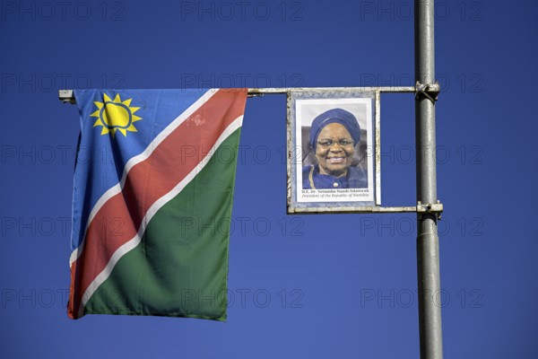 Namibian flag and image of President Dr. Netumbo Nandi-Ndaitwah on a street lamp, Windhoek, Khomas region, Namibia