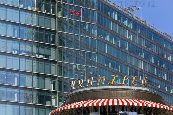 Historic Café Kranzler logo with modern office building and H&M logo on Kurfürstendamm, Charlottenburg, Berlin, Germany