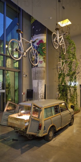 Entrance area to Monkey Bar with old Trabi in the evening, Charlottenburg, Berlin, Germany