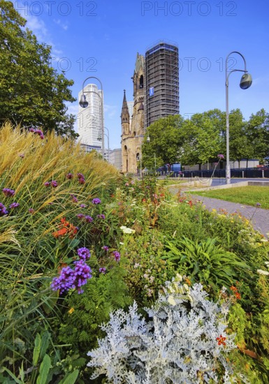 Planted middle strip of Tauentzienstraße with Kaiser Wilhelm Memorial Church, promenade, Charlottenburg, Berlin, Germany