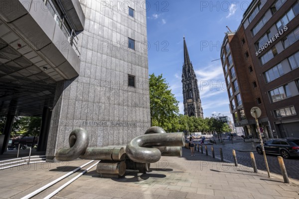 Deutsche Federal Bank building with modern sculpture, tower of the destroyed St. Nikolai church in the back, Hamburg, Germany