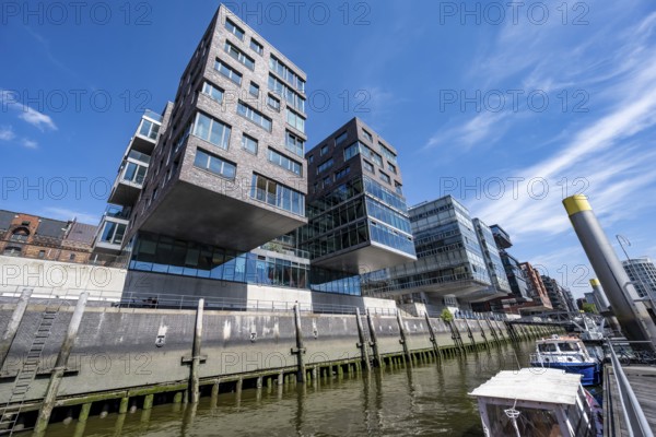 Modern residential buildings, traditional shipping harbor on Sandtorkai, behind Elbphilharmonie, HafenCity, Hamburg, Germany