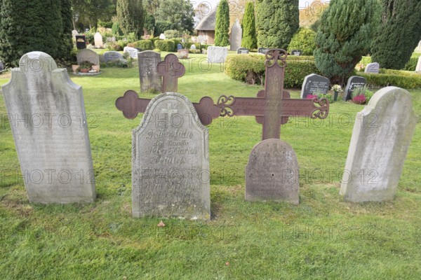 Cemetery of St John's Church with gravestones telling the story of seafarers, known as talking gravestones, Nieblum, Föhr Island, Schleswig-Holstein, Germany